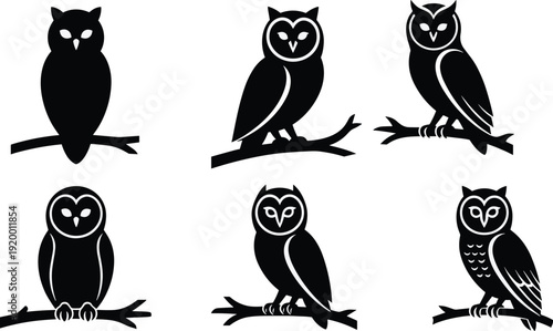 Black and white owl silhouettes on branches owls