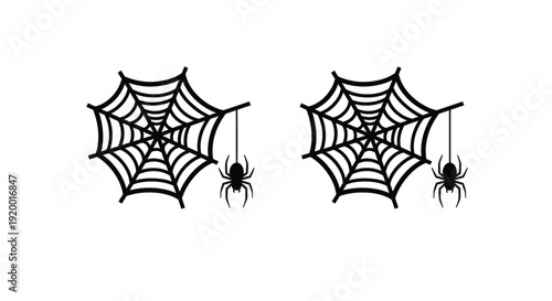 Two spiderwebs with spiders hanging a dark spooky silhouette