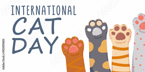Celebrating international cat day with adorable paw prints and text
