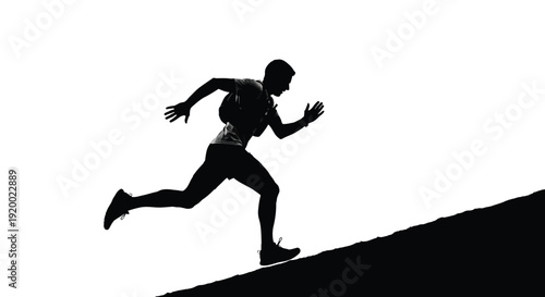 Man running uphill silhouette on slope