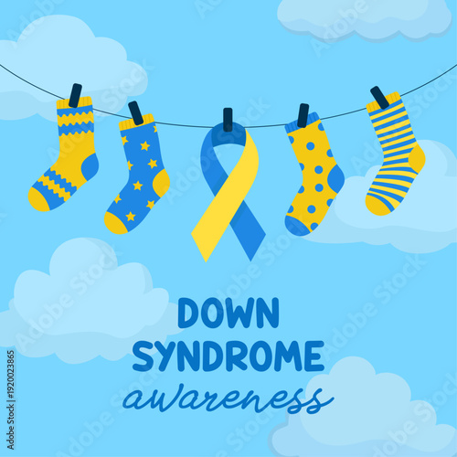 Down syndrome awareness hanging yellow and blue socks sky and clouds in background