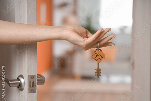 Female hand with key from h...