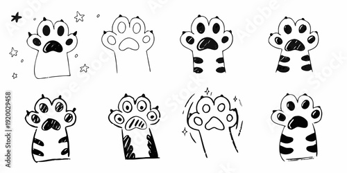 Collection of cute hand drawn black and white animal paw prints with stars
