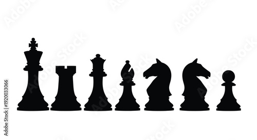 Black chess pieces arranged in a row dramatic silhouette