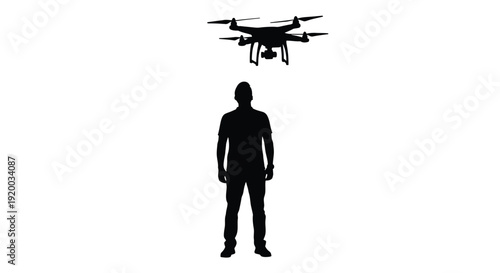 A person stands beneath a flying drone against a white background silhouette