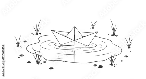 A hand-drawn paper boat floats gently in a small puddle of water surrounded by grass and pebbles.