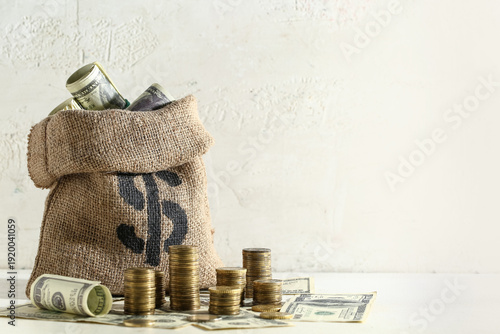 Bag with dollars and coins ...