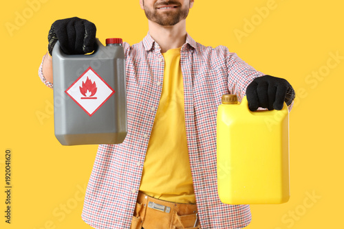 Young man with canisters on...