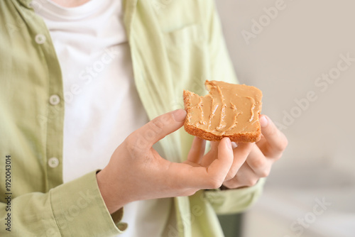 Young man holding toast wit...