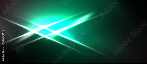 Abstract green light flares radiate from center. Dark background creates dramatic visual effect. Brightness contrasts sharply.