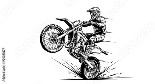 Motorcyclist performing a wheelie on a dirt bike.