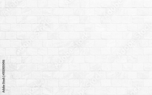 Kitchen wallpaper concept: Close up modern white brick tiles wall texture background, White brick wall texture background for stone tile block in grey light color wallpaper modern interior.