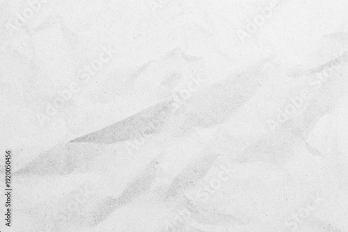 White recycled craft paper texture as background. Grey paper texture, Old vintage page or grunge vignette of old newspaper. Pattern rough art creased grunge letter. Hardboard with copy space for text.