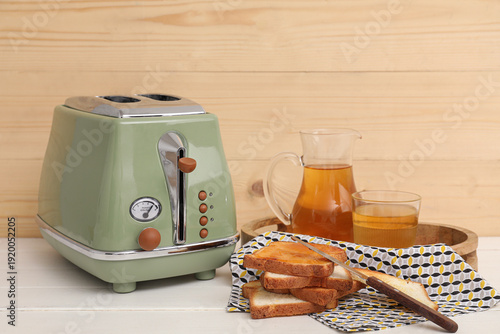 Green toaster with bread sl...