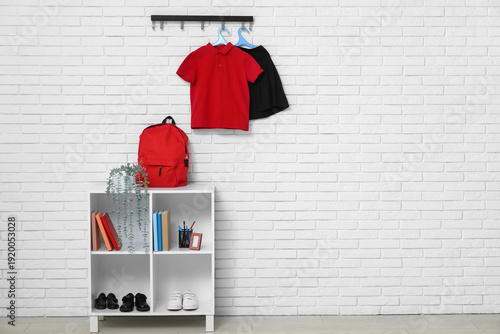 Rack with backpack, books, ...