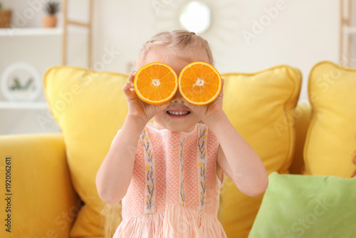 Cute little girl with orang...
