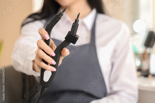 Female hairdresser with ton...
