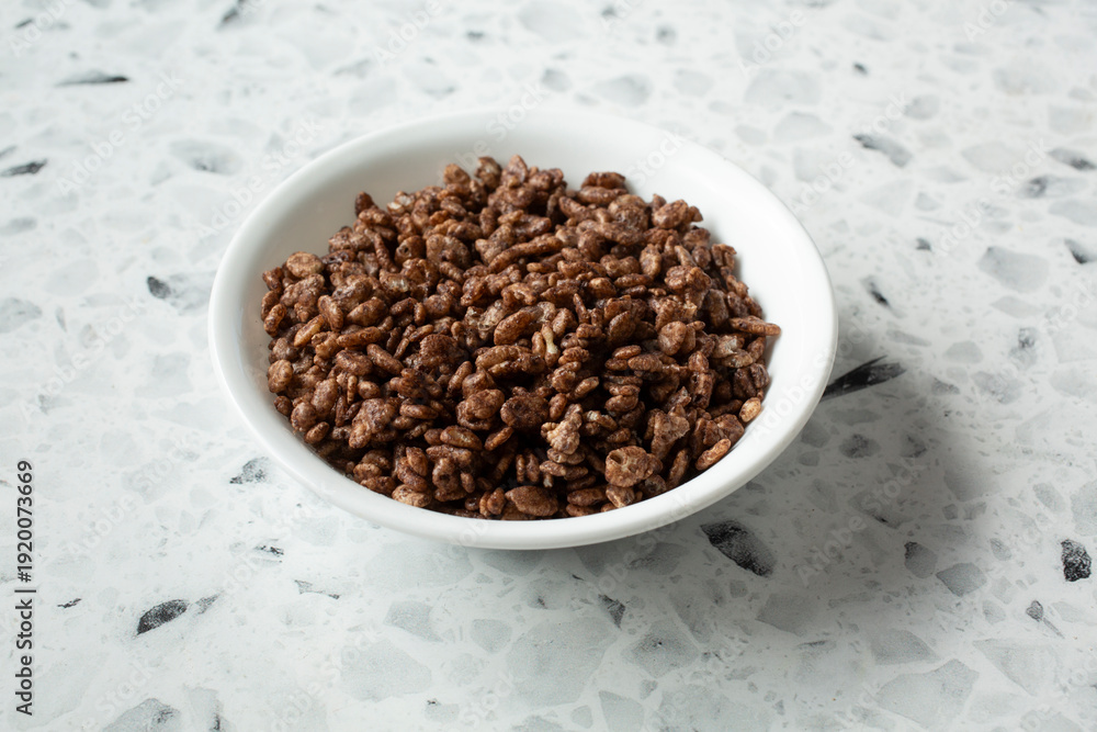 Fototapeta premium A view of a bowl of chocolate crispy rice cereal.