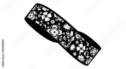 Black fabric headband with white floral pattern decorative hair accessory for women isolated on white background