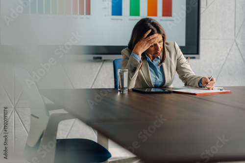 Tableau sur toile Stressed businesswoman suffering headache and burnout
