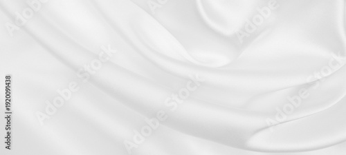 Smooth elegant white silk or satin luxury cloth texture as wedding background. Luxurious background design