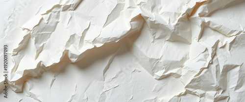 Close-up of crumpled, off-white paper showing fibrous texture and subtle shadows,   minimal texture,  crumpled paper