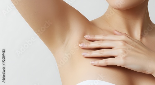 Woman touching smooth underarm skin care routine