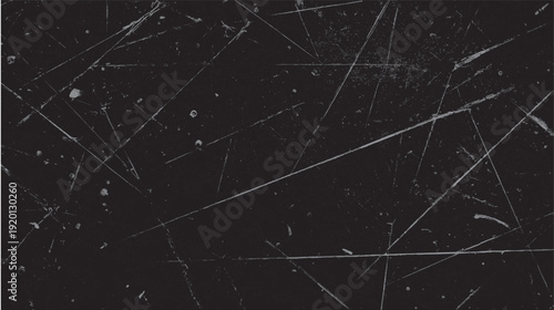 Dark textured background with numerous fine scratches and small speckles grunge