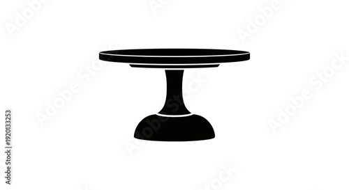 A simple black silhouette of a round pedestal table with a flared base stands isolated