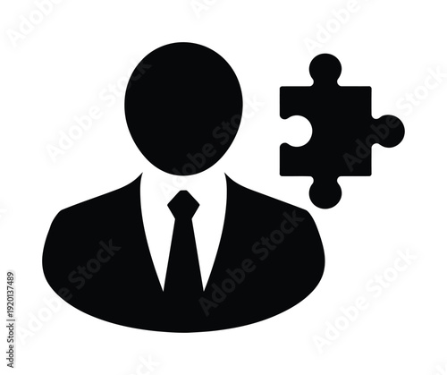 Vector silhouette of a businessman with a puzzle piece for a head.