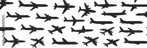Collection of diverse aircraft silhouettes arranged in grid pattern, featuring commercial jets, cargo planes, and military airplanes for aviation, transport, and engineering illustration concepts
