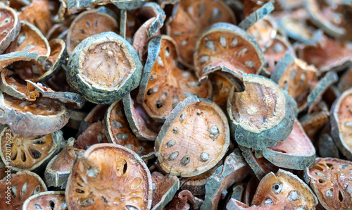 Dried bael fruit slices. Traditional herbal ingredient for Bael Ttea, used for healthy drinks, symbolizing natural medicine, Thai wisdom, and organic herbal products