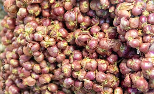Shallots, Fresh red shallots piled together, vibrant purple tones and rich texture. Ideal for food, agriculture, market, natural ingredient, and background concepts