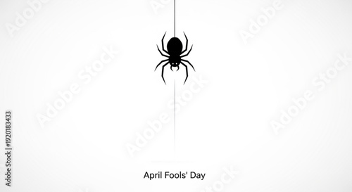 Black spider hanging from a thread on white background with april fools' day text