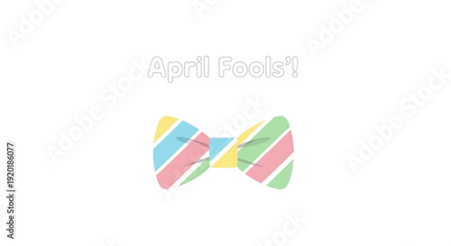 Colorful striped bow tie with april fools' text on white background for prank or joke