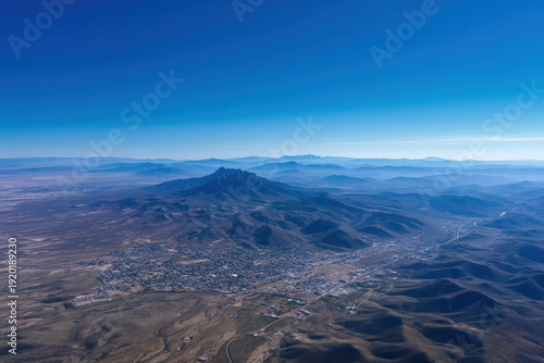 Aerial view of the mountainous area with blue sky.