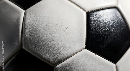 Close up of a soccer ball with black and white panels