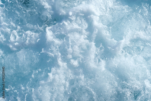 Photography Turbulent ocean water surface with frothy waves and splashes, showcasing various