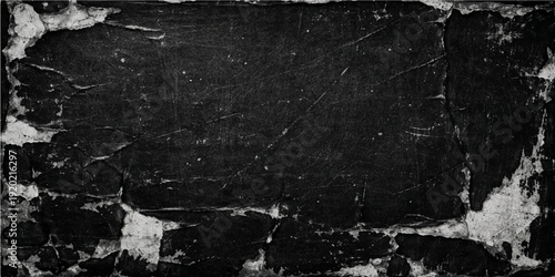 An aged black and white grunge wall texture features a dark dirty concrete surface with a rough vintage stone pattern and weathered antique material for a moody backdrop design