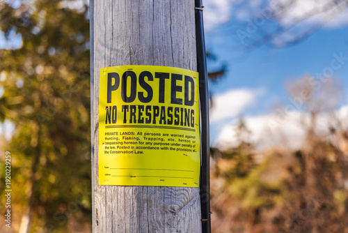 Photos Private property no trespassing notice attached to utility pole outdoors