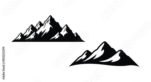 Dramatic mountain range and peak depicted in a stark silhouette