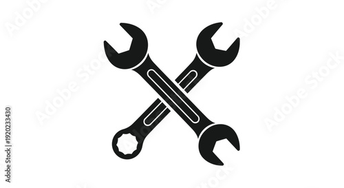 Two crossed wrenches depicted in a stark black silhouette