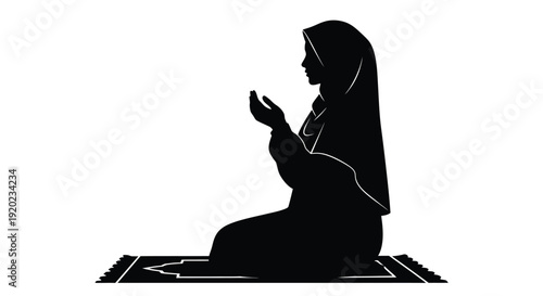 Praying woman in traditional clothing a striking black silhouette