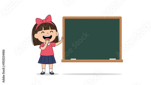 Cheerful little girl with a large red bow on her head stands next to a large blank green chalkboard with a big smile.