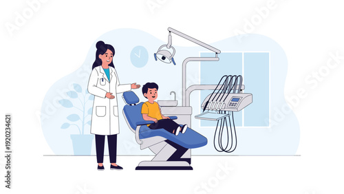 Caring female dentist in a white coat talks to a young boy sitting in a dental chair during a routine checkup.