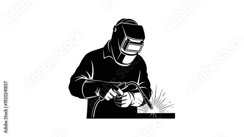 Welder working with welding torch creating sparks.