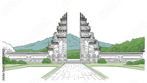 Iconic Balinese temple gate with mountains and lush greenery in the background