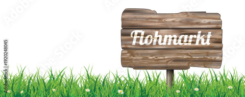 Holzschild Flohmarkt auf grüner Wiese