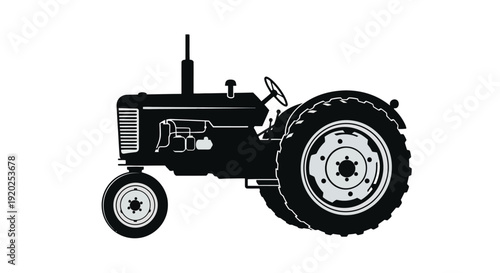 Vintage tractor silhouette against a stark white background