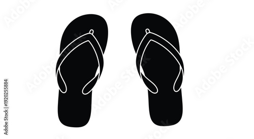 Two black flip flops rest on a white surface a striking silhouette